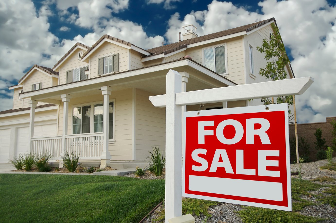 Home for Sale Sign and House